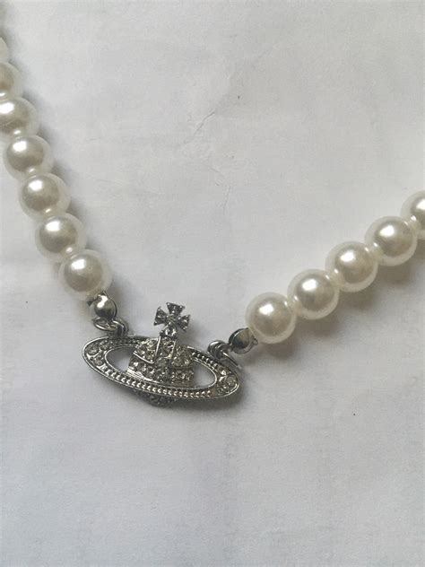 necklace with pearls and saturn